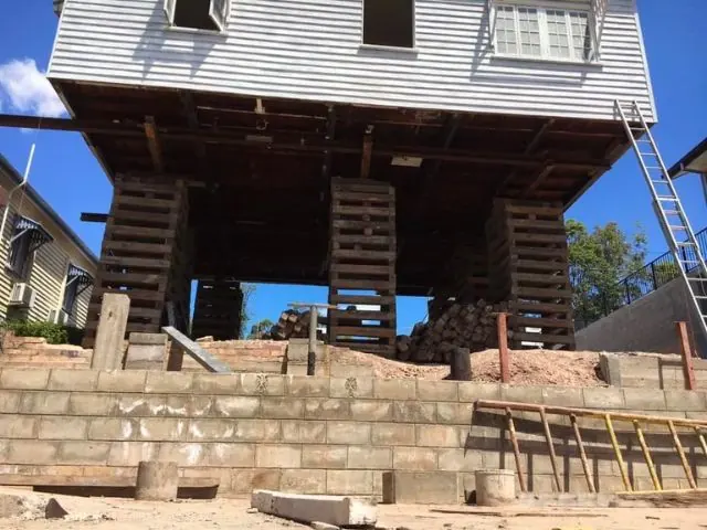 Timber home raised on new posts